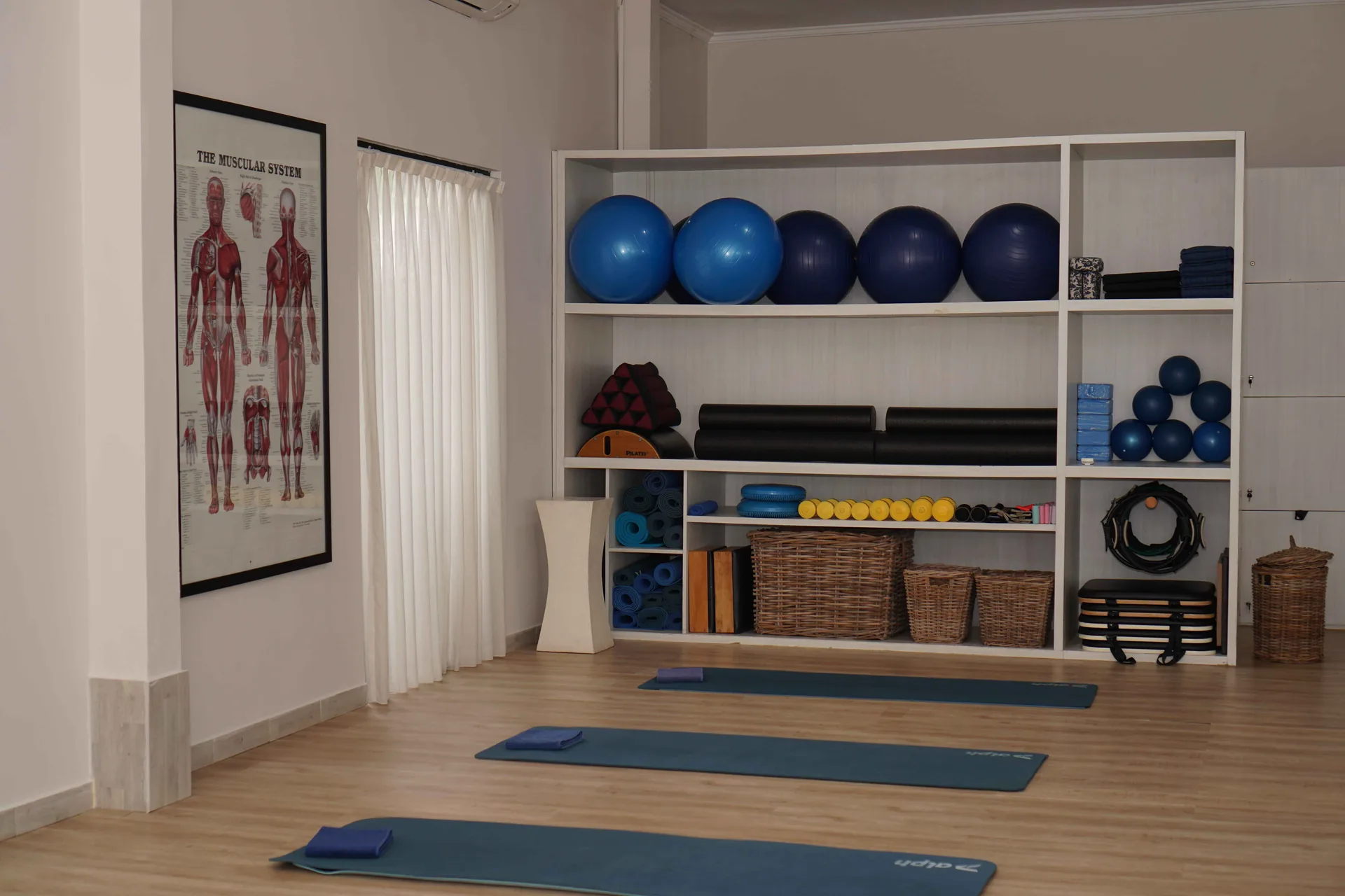 Sunset Pilates studio mats and props illuminated by early morning Bali sunlight